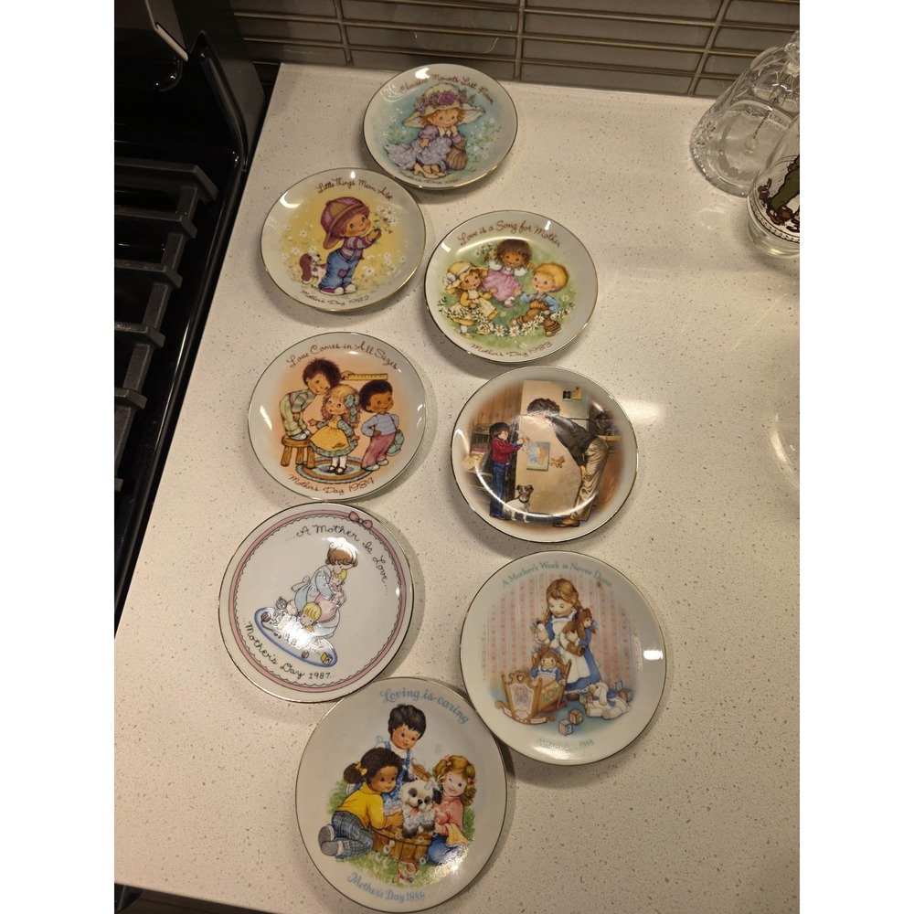 Set of 8 Avon Collectable Plates 1980s